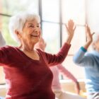 Group of seniors participating in a yoga class